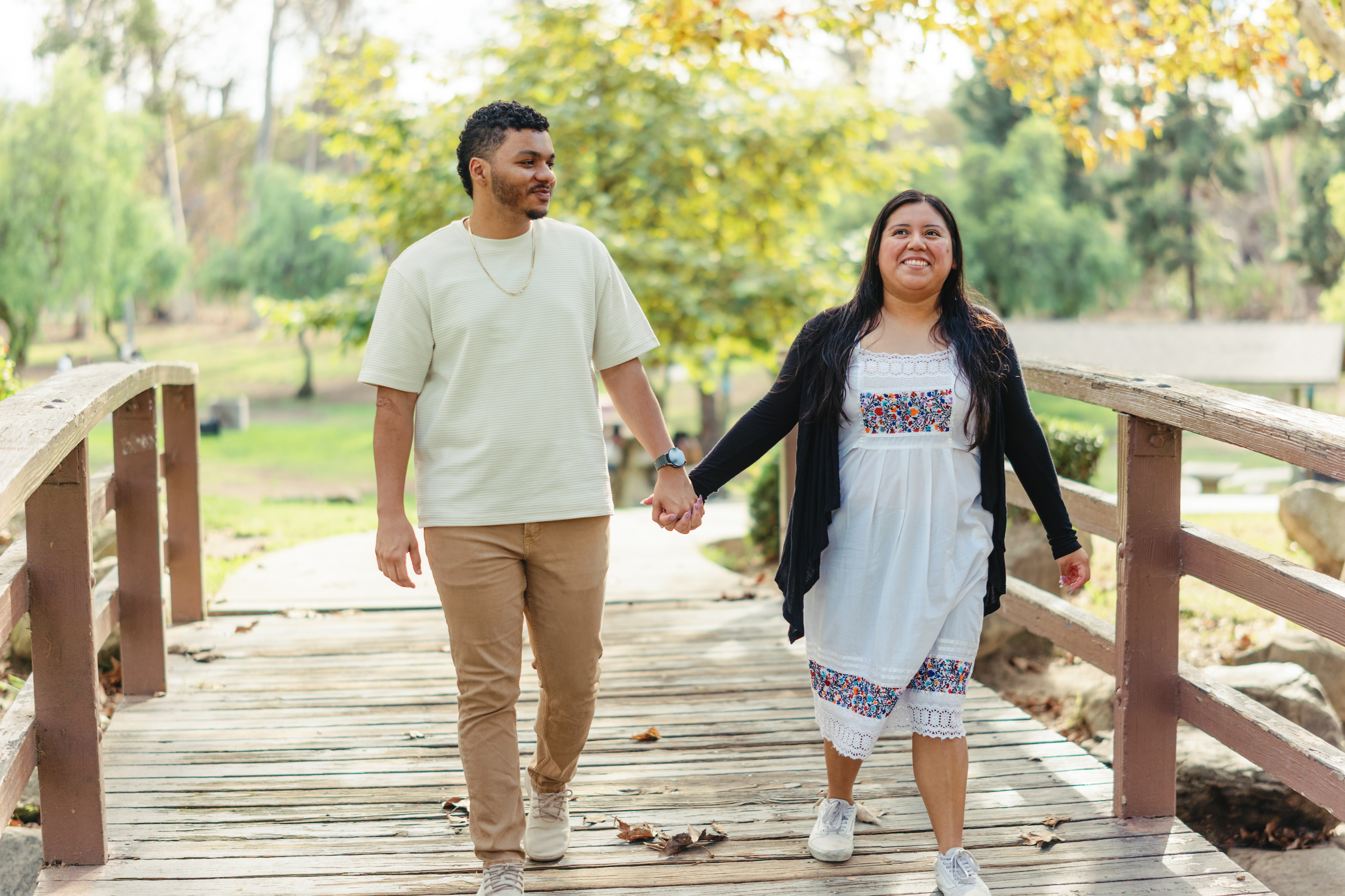 Couple standing together on a wooden walkway