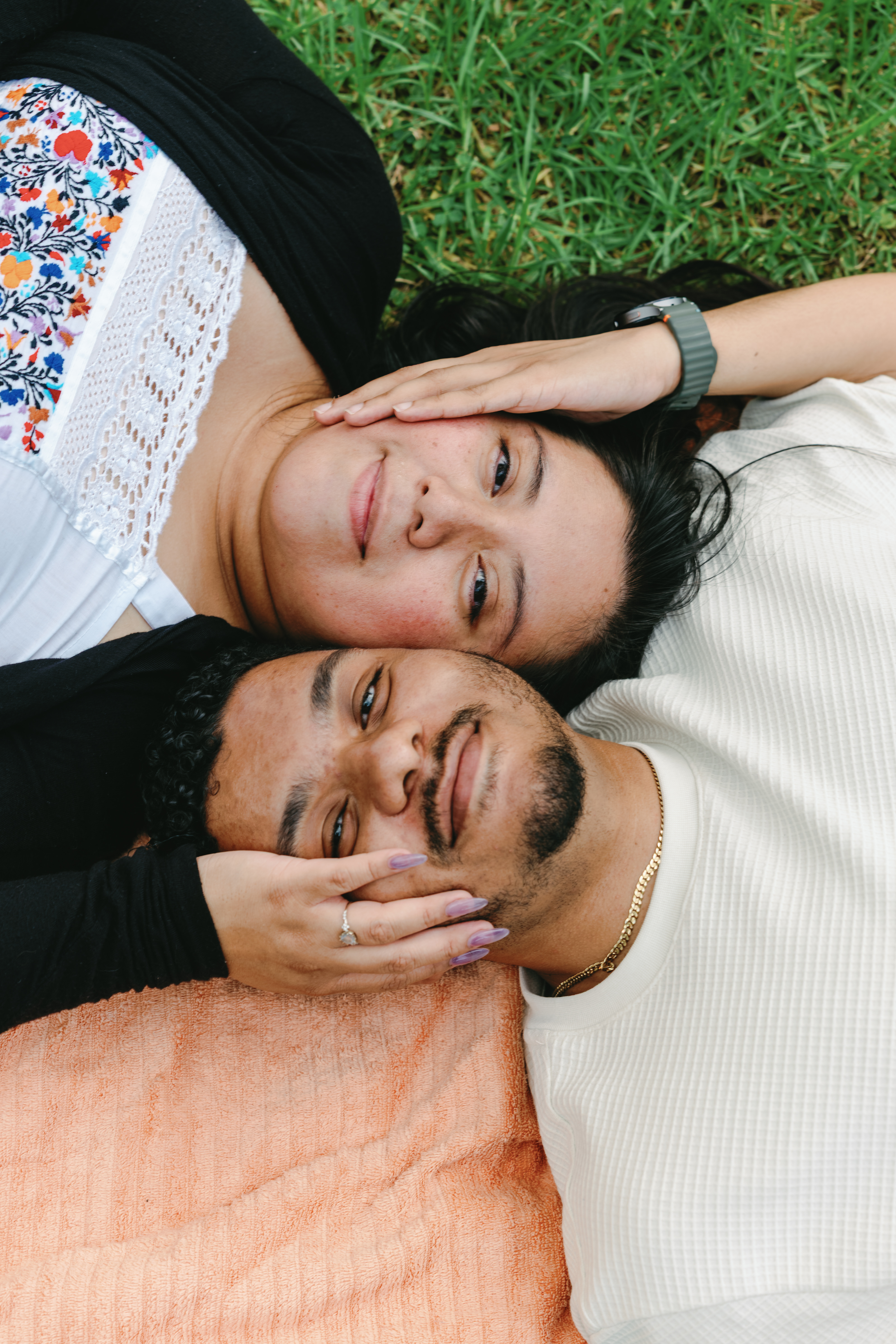 Couple relaxing together on the grass